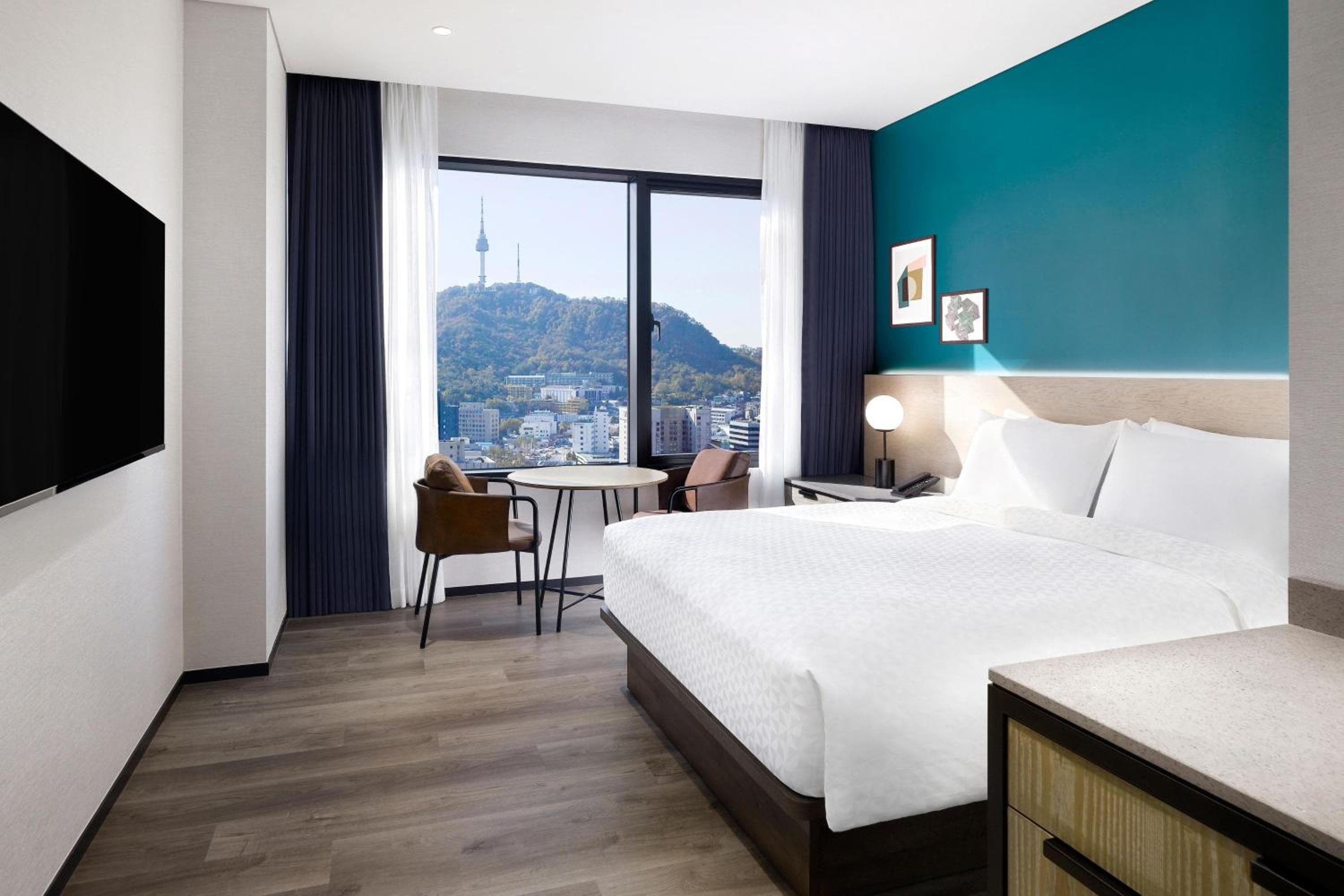Superior room with a double bed and city view