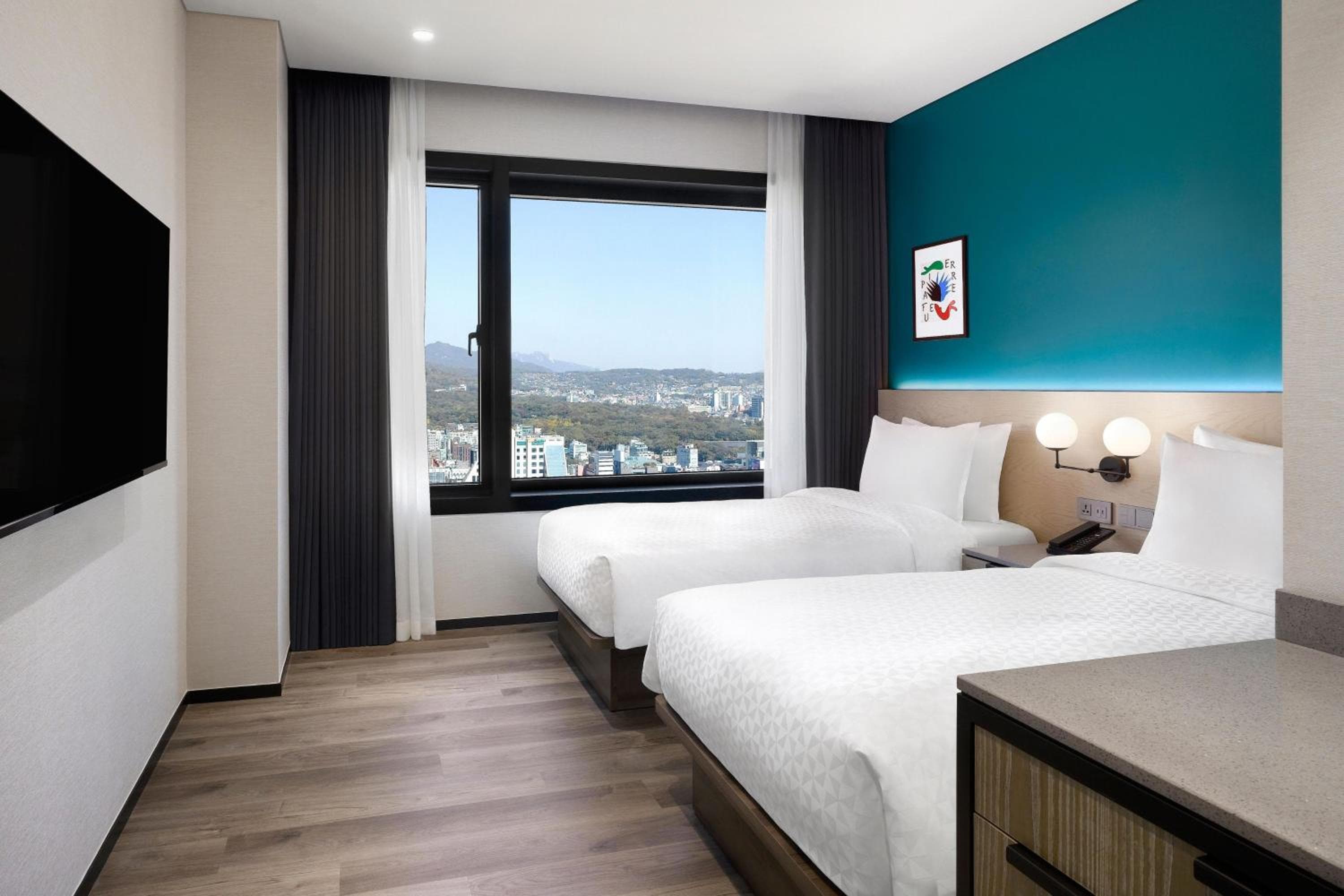 Superior room with two twin beds and city view